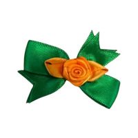 corsage roosjes / speld groen oranje kruikenstad