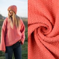 Gebreide boucle wol koraal kleur