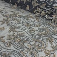 Haute couture kant grijs beige met pailletten en kralen