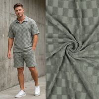 Tricot badstof met blokjes motief salie groen